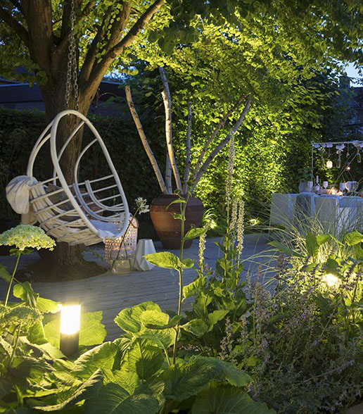 In-Lite Liv Dark Grey bollard installed in garden