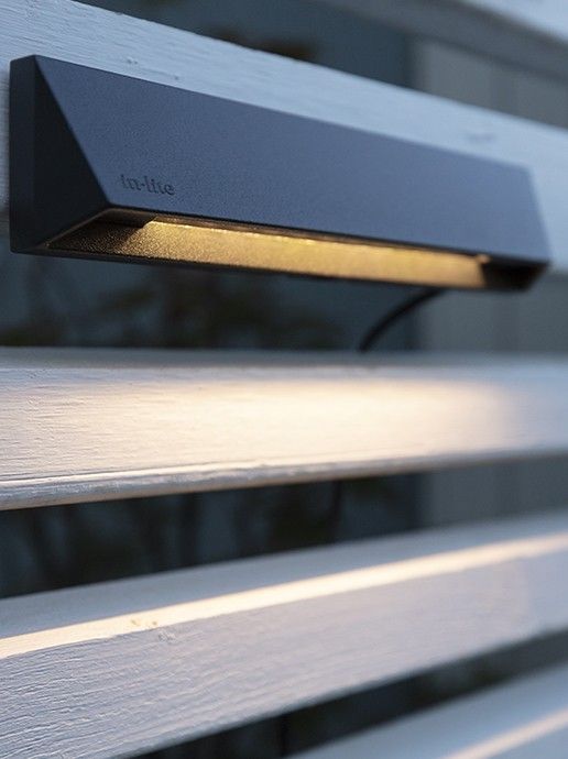 Wedge Slim 12V light installed on a fence