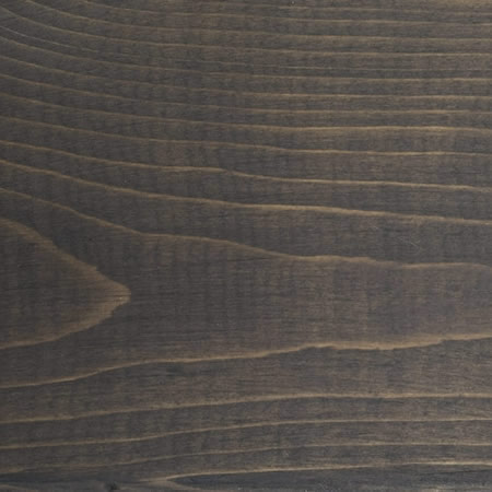 black ash finish cutek sample on brown pressure treated lumber