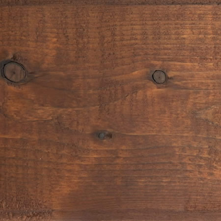 burnt red finish cutek sample on brown pressure treated lumber