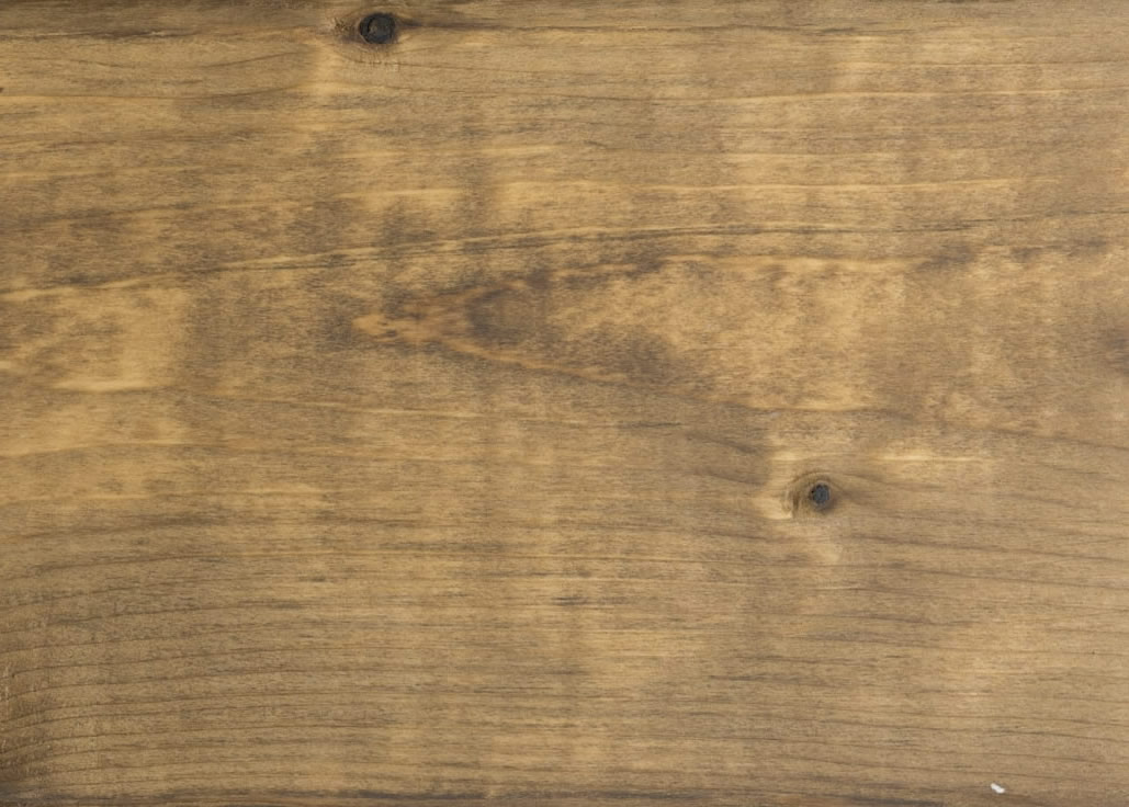 clear finish cutek sample on brown pressure treated lumber