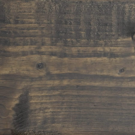 graphite grey finish cutek sample on brown pressure treated lumber