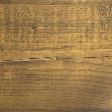 honeycomb finish cutek sample on brown pressure treated lumber