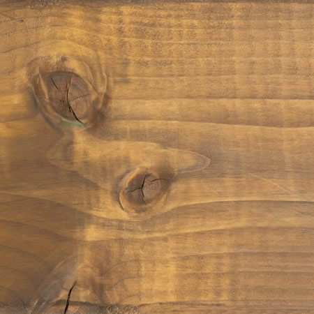 rustic gold finish cutek sample on brown pressure treated lumber